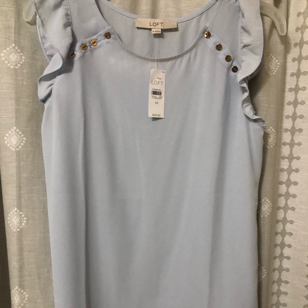 Light blue ruffle button blouse